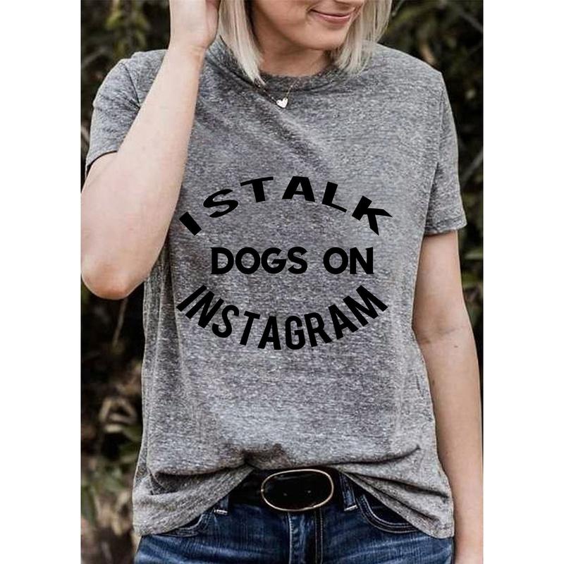A soft crew neck tee featuring the quote 'I Stalk Dogs on Instagram', perfect for dog lovers.