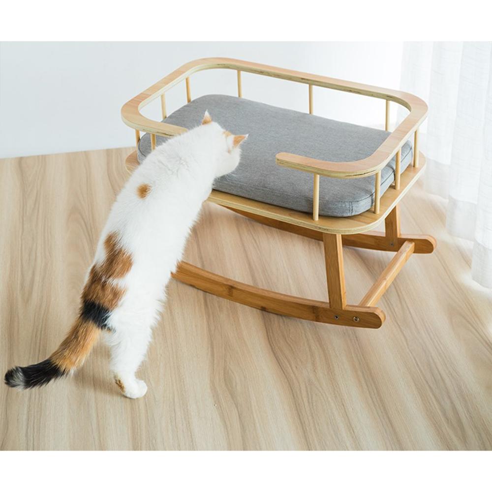 INSTACHEW Rockaby Pet Bed in grey and brown, featuring a soft cushion and bamboo wooden frame, designed for small to medium pets.