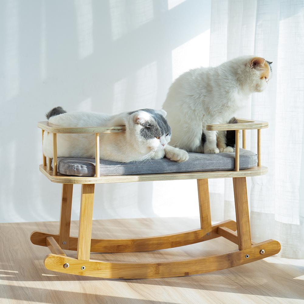 INSTACHEW Rockaby Pet Bed in grey and brown, featuring a soft cushion and bamboo wooden frame, designed for small to medium pets.