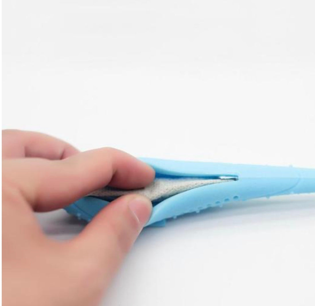 Interactive Cat Toothbrush with soft silicone nubs designed for cleaning cat's teeth and massaging gums, featuring a catnip pod for attraction.