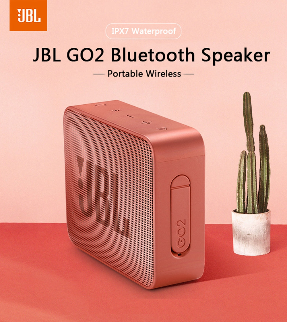 JBL GO2 Bluetooth speaker in vibrant colors, showcasing its waterproof design and compact size, perfect for outdoor use.
