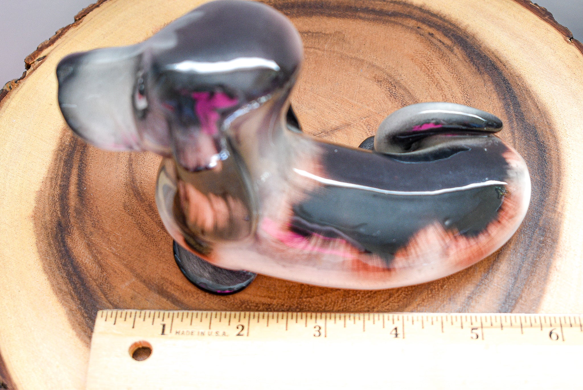 Vintage J. W. Co. Dachshund figurine made of porcelain, approximately 5 inches tall, showcasing intricate details and craftsmanship.