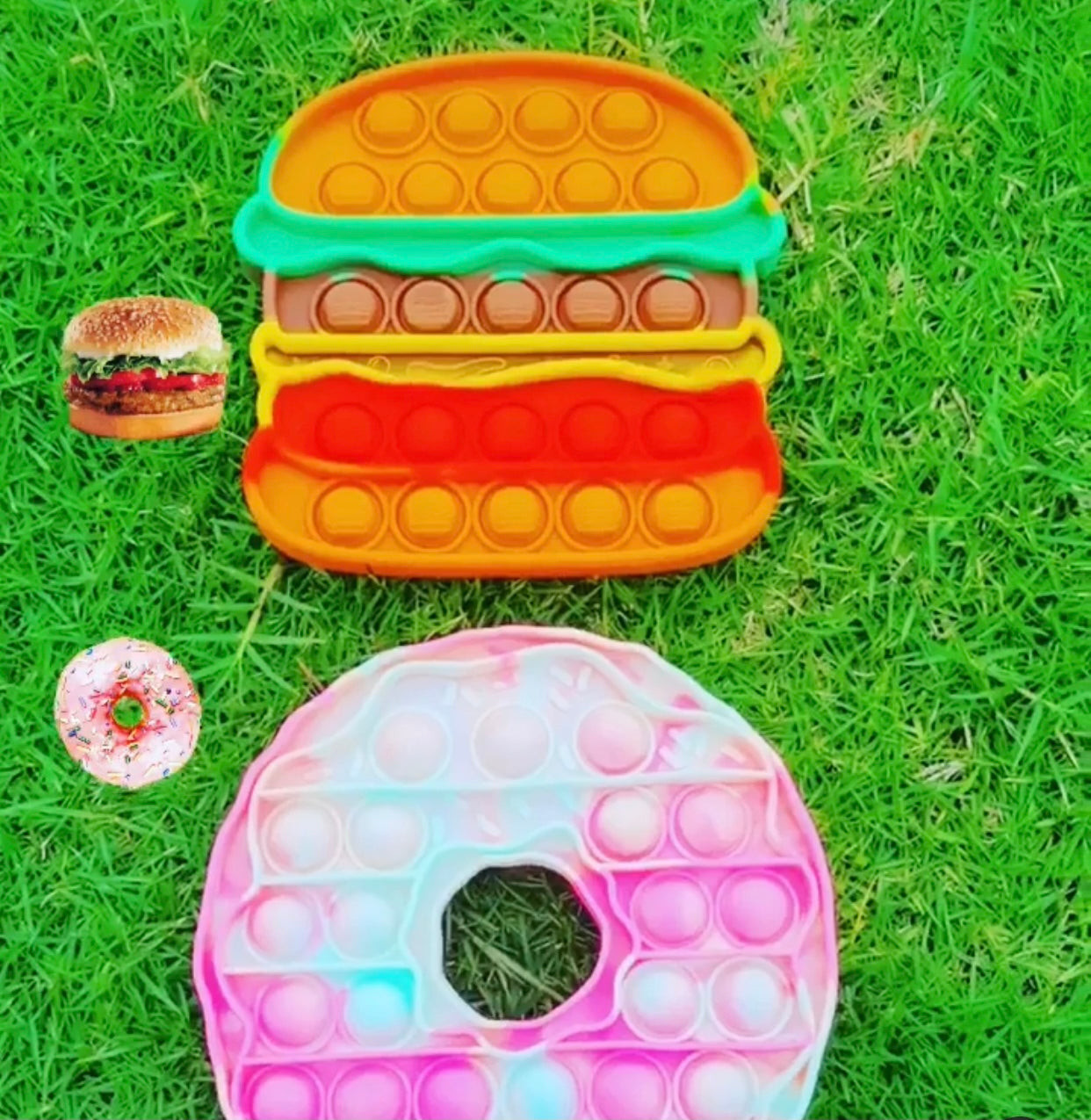 Jumbo Push Pop Fidget Sensory toys featuring colorful Hamburger and Donut designs, made from durable silicone for stress relief and fun.
