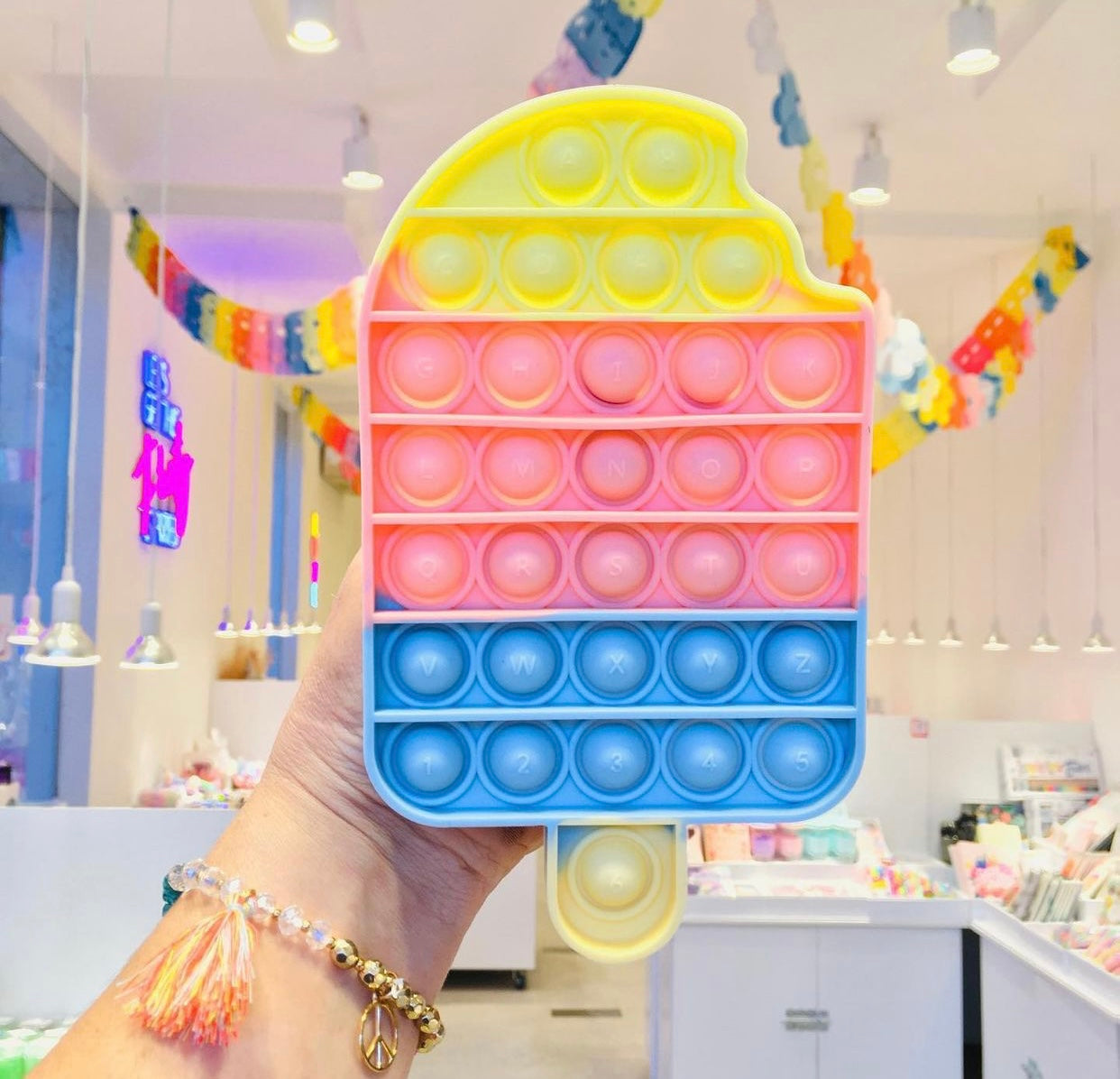 Jumbo Push Pop Fidget Sensory toy from the Popsicle collection, featuring colorful silicone bubbles for sensory play.