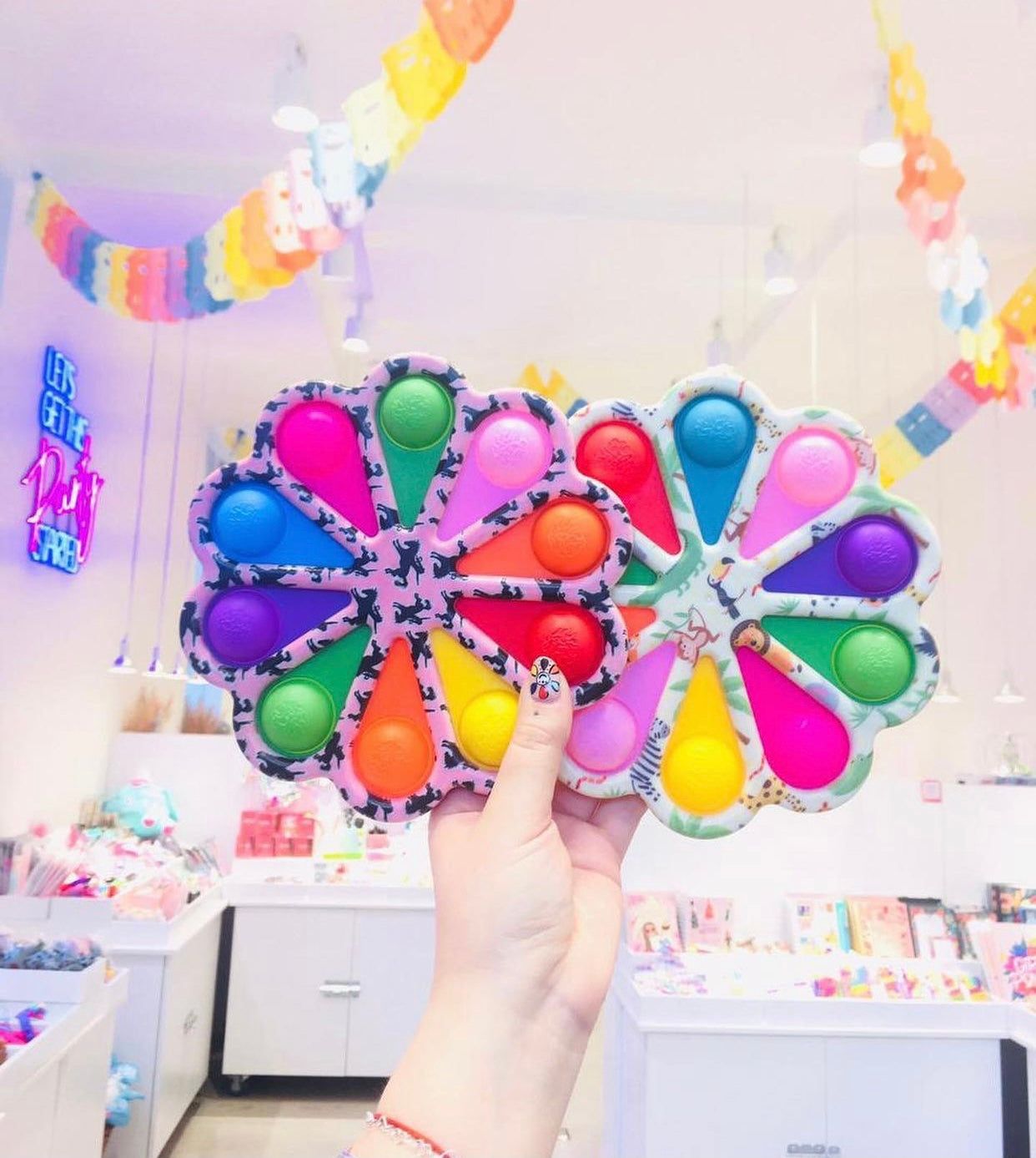 A colorful Jumbo Push Pop Fidget Sensory toy featuring a rainbow design, showcasing its large size and durable silicone material.