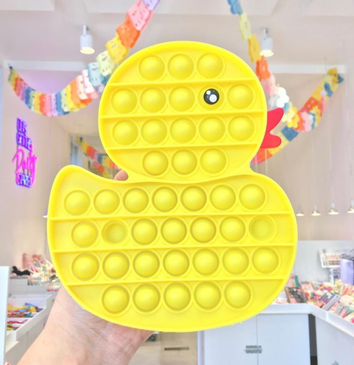 Jumbo Push Pop Fidget Sensory Toy in Yellow Duck design, showcasing its vibrant colors and large popping bubbles.