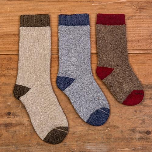 Kid's Alpaca Copper TrailBlazer socks in Oat, Silver, and Hickory colors, showcasing their luxurious texture and design.