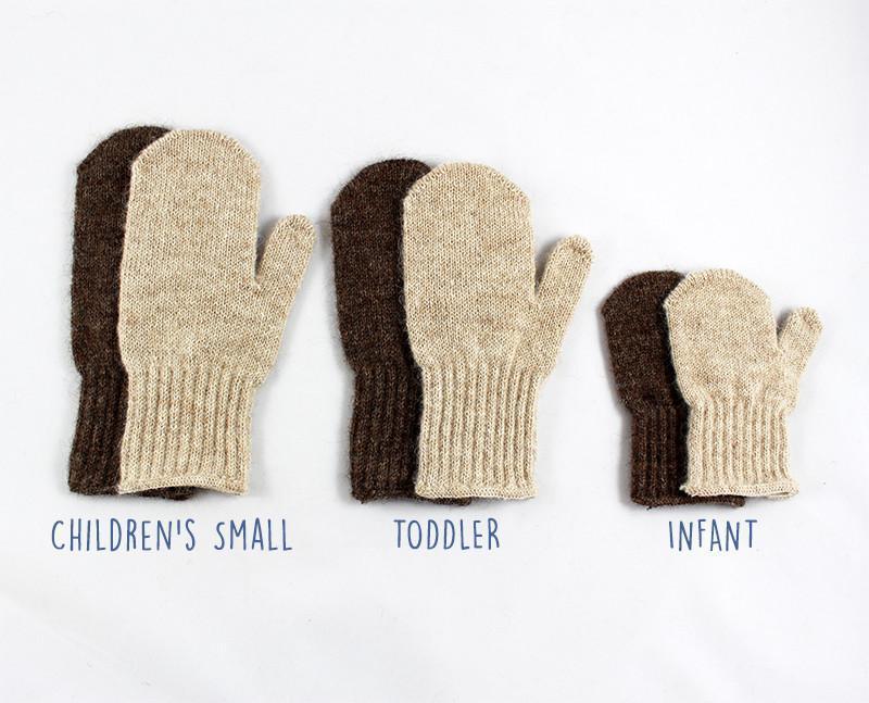 A pair of soft Kids Alpaca Mittens in Suri Light Fawn and Suri Rose Grey, perfect for keeping children's hands warm.