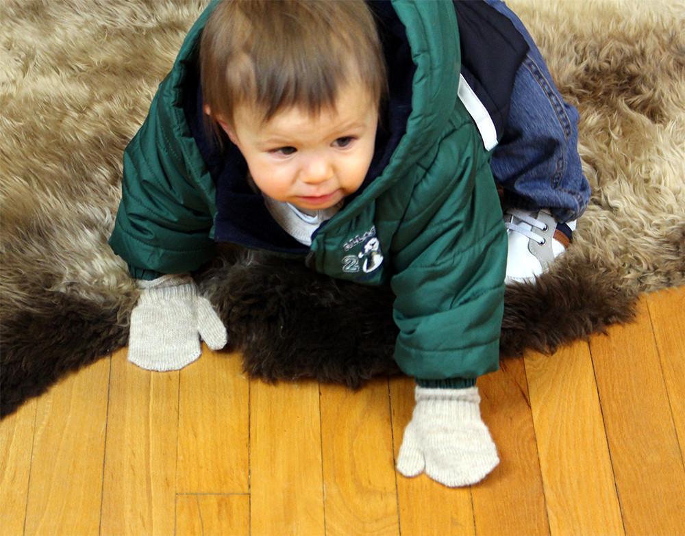 A pair of soft Kids Alpaca Mittens in Suri Light Fawn and Suri Rose Grey, perfect for keeping children's hands warm.