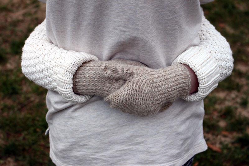 A pair of soft Kids Alpaca Mittens in Suri Light Fawn and Suri Rose Grey, perfect for keeping children's hands warm.