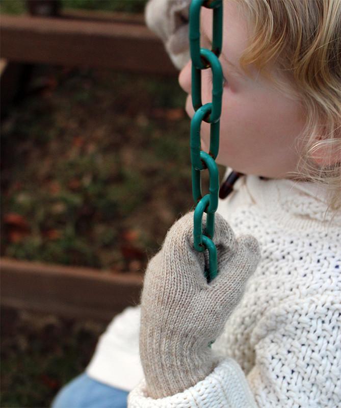 A pair of soft Kids Alpaca Mittens in Suri Light Fawn and Suri Rose Grey, perfect for keeping children's hands warm.