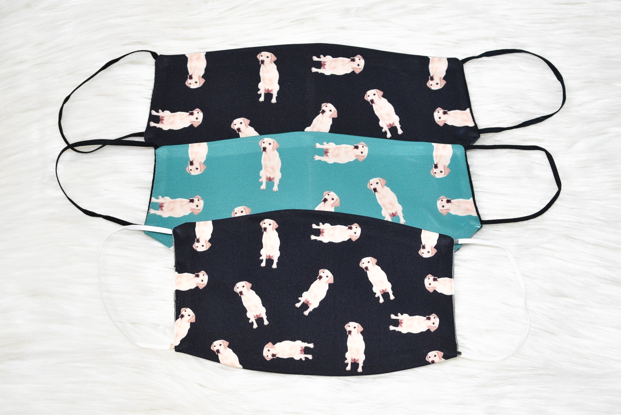 A handmade Labrador Retriever face cover featuring a soft organic cotton interior and durable polyester exterior, available in various sizes.