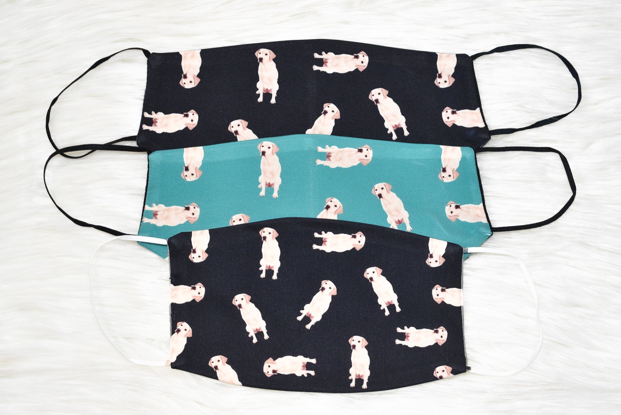 A handmade Labrador Retriever face cover featuring a soft organic cotton interior and durable polyester exterior, available in various sizes.