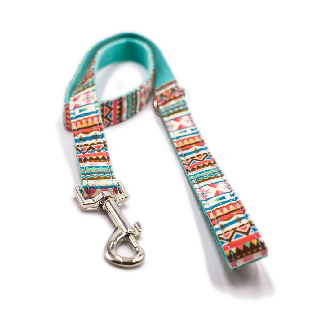 A vibrant tropical-themed dog leash featuring heavy-duty silver hardware and reinforced nylon strapping, perfect for stylish walks.