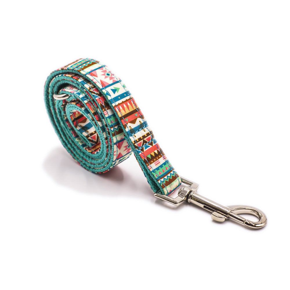 A vibrant tropical-themed dog leash featuring heavy-duty silver hardware and reinforced nylon strapping, perfect for stylish walks.