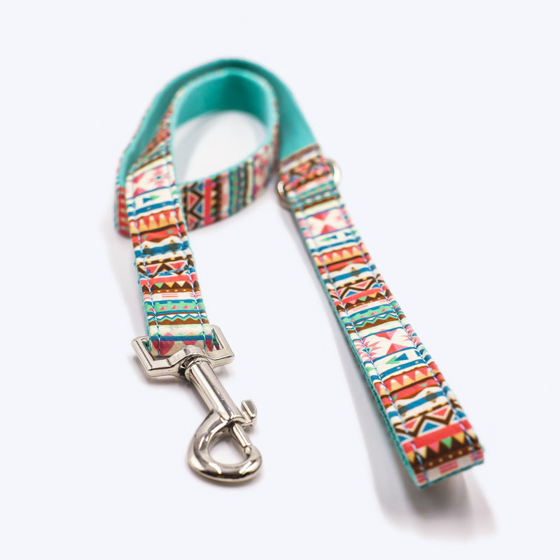 A vibrant tropical-themed dog leash featuring heavy-duty silver hardware and reinforced nylon strapping, perfect for stylish walks.