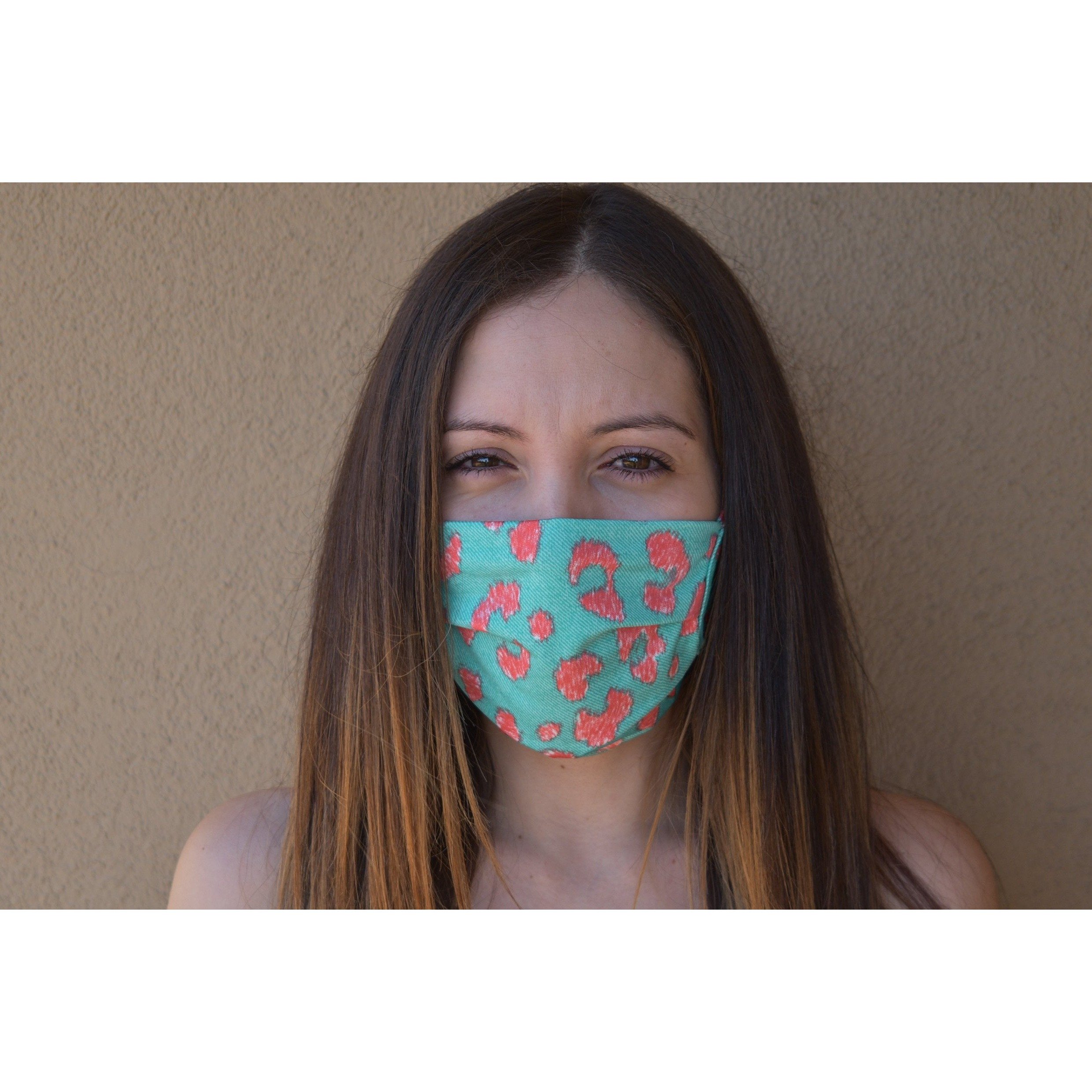 A stylish leopard print face covering made of soft cotton, designed for comfort and breathability.