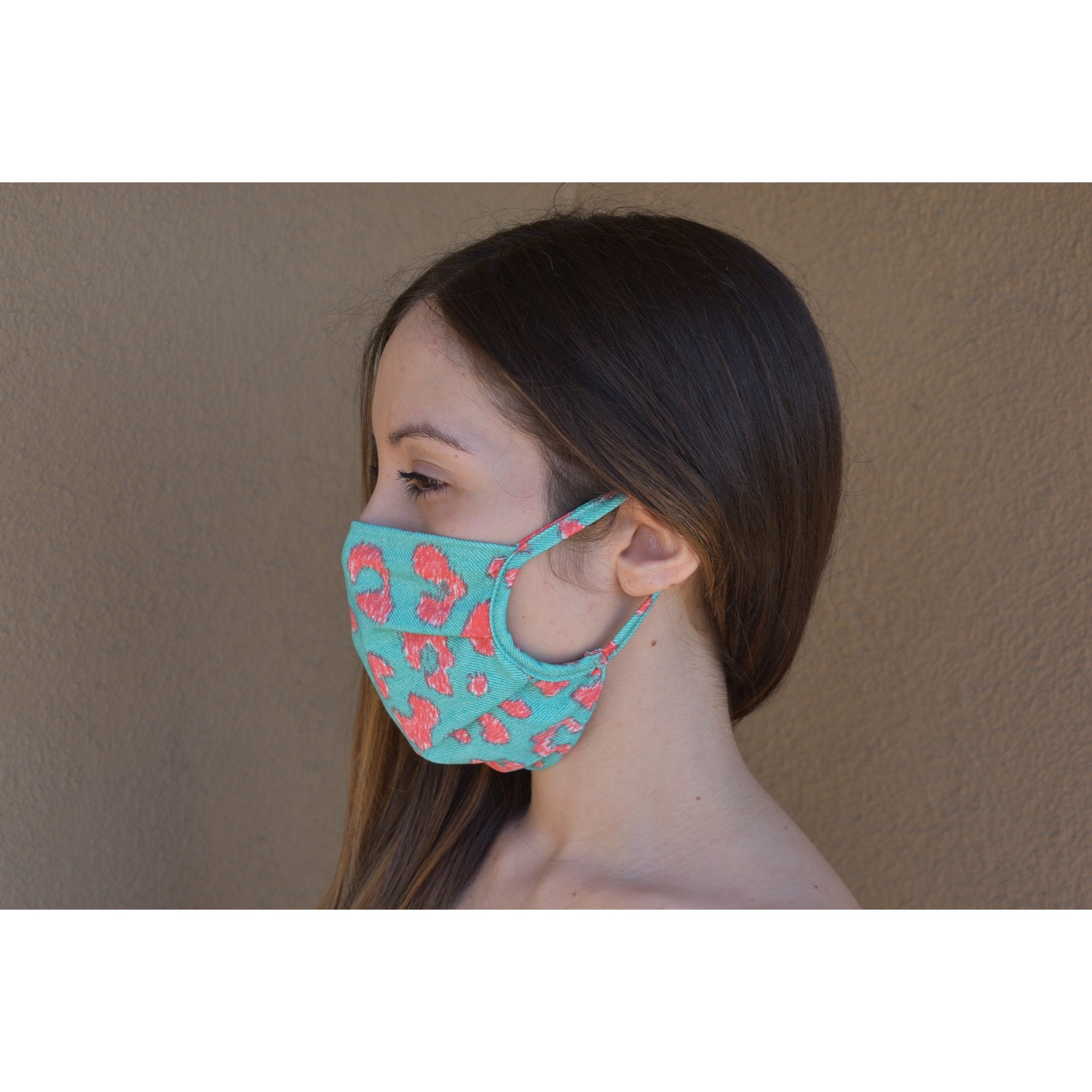 A stylish leopard print face covering made of soft cotton, designed for comfort and breathability.