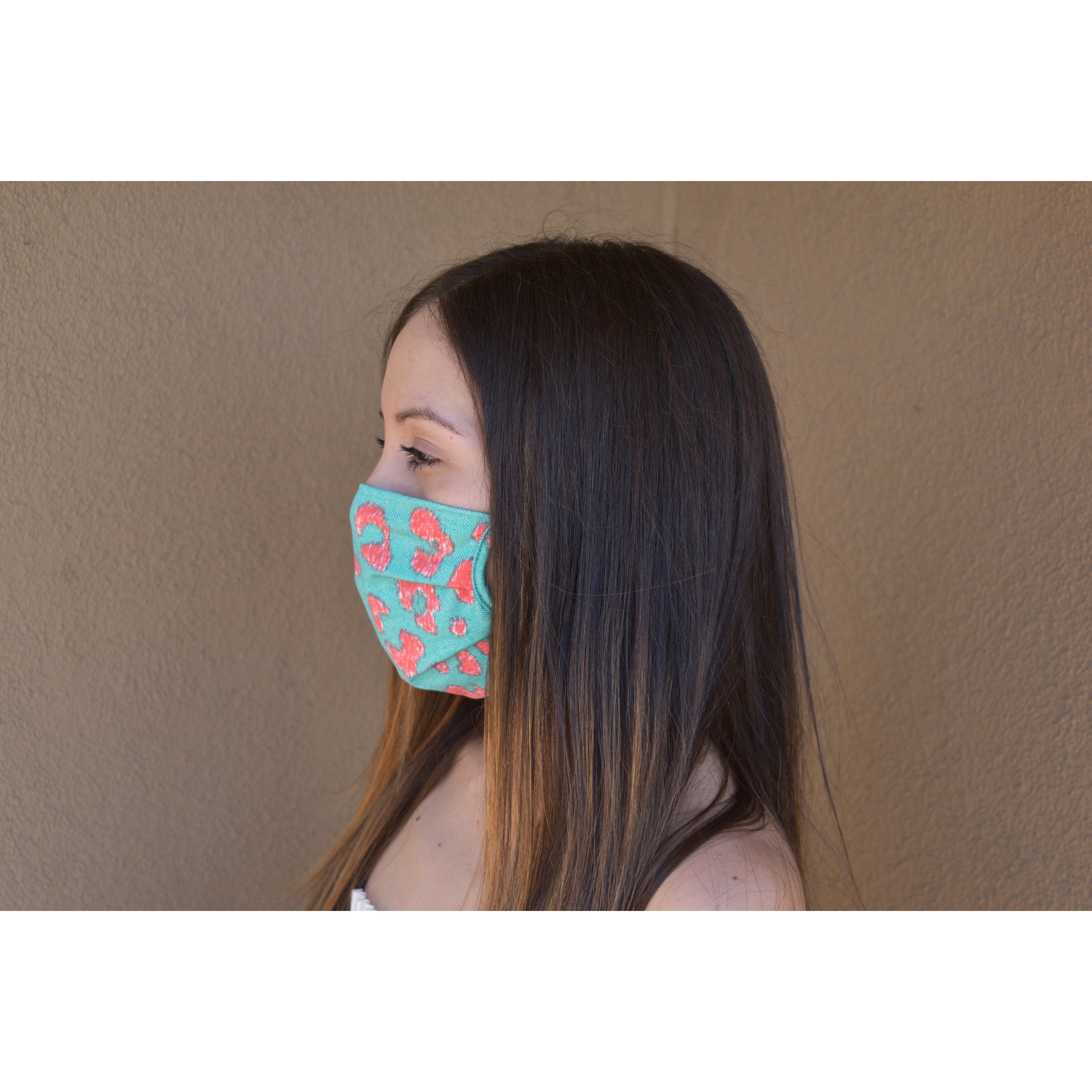 A stylish leopard print face covering made of soft cotton, designed for comfort and breathability.