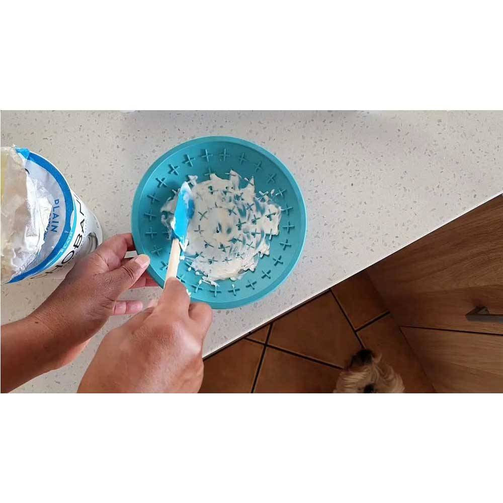 Lickimat Splash Bowl in vibrant colors, designed for dogs and cats, featuring a suction cap for secure attachment during feeding.