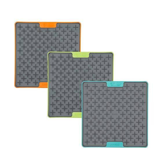 Lickimat TUFF Soother for Dogs in vibrant colors, designed for interactive feeding and calming pets.