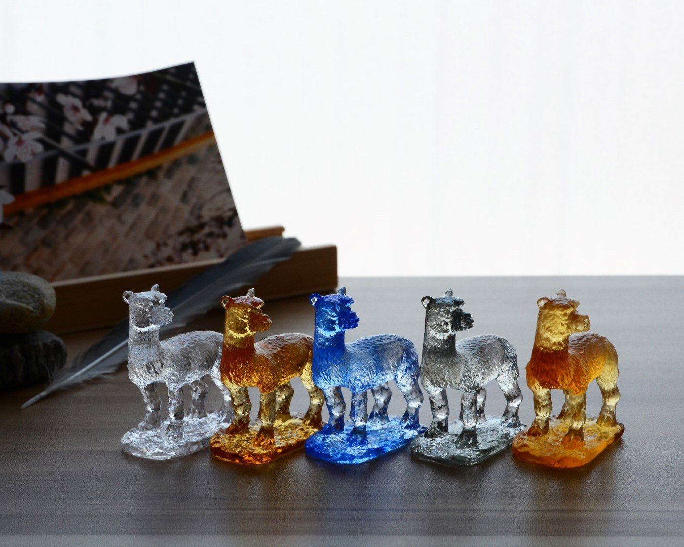 A beautifully crafted Liuli Crystal Alpaca Figurine showcasing intricate details and vibrant colors, perfect for home decor.