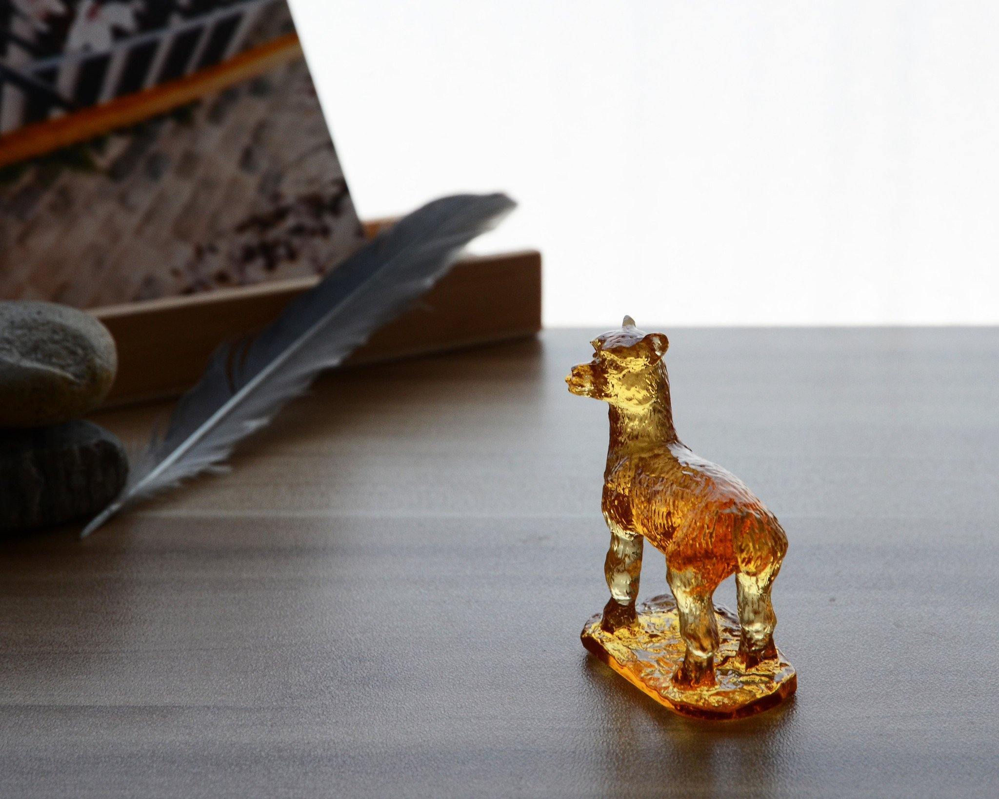 A beautifully crafted Liuli Crystal Alpaca Figurine showcasing intricate details and vibrant colors, perfect for home decor.