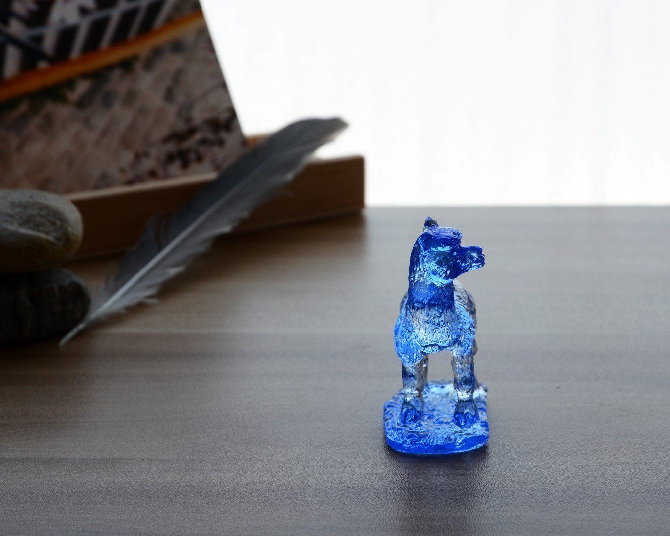 A beautifully crafted Liuli Crystal Alpaca Figurine showcasing intricate details and vibrant colors, perfect for home decor.