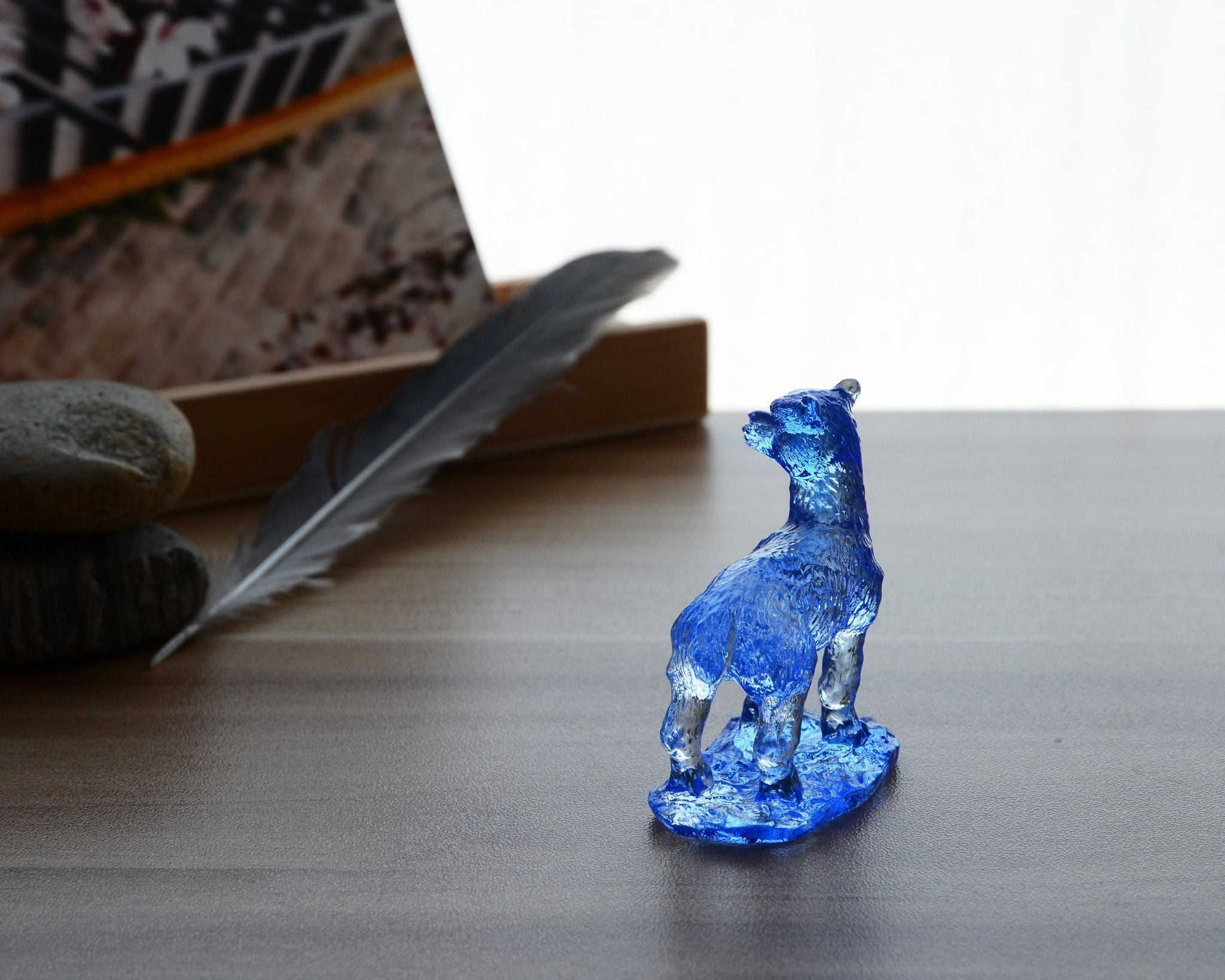 A beautifully crafted Liuli Crystal Alpaca Figurine showcasing intricate details and vibrant colors, perfect for home decor.