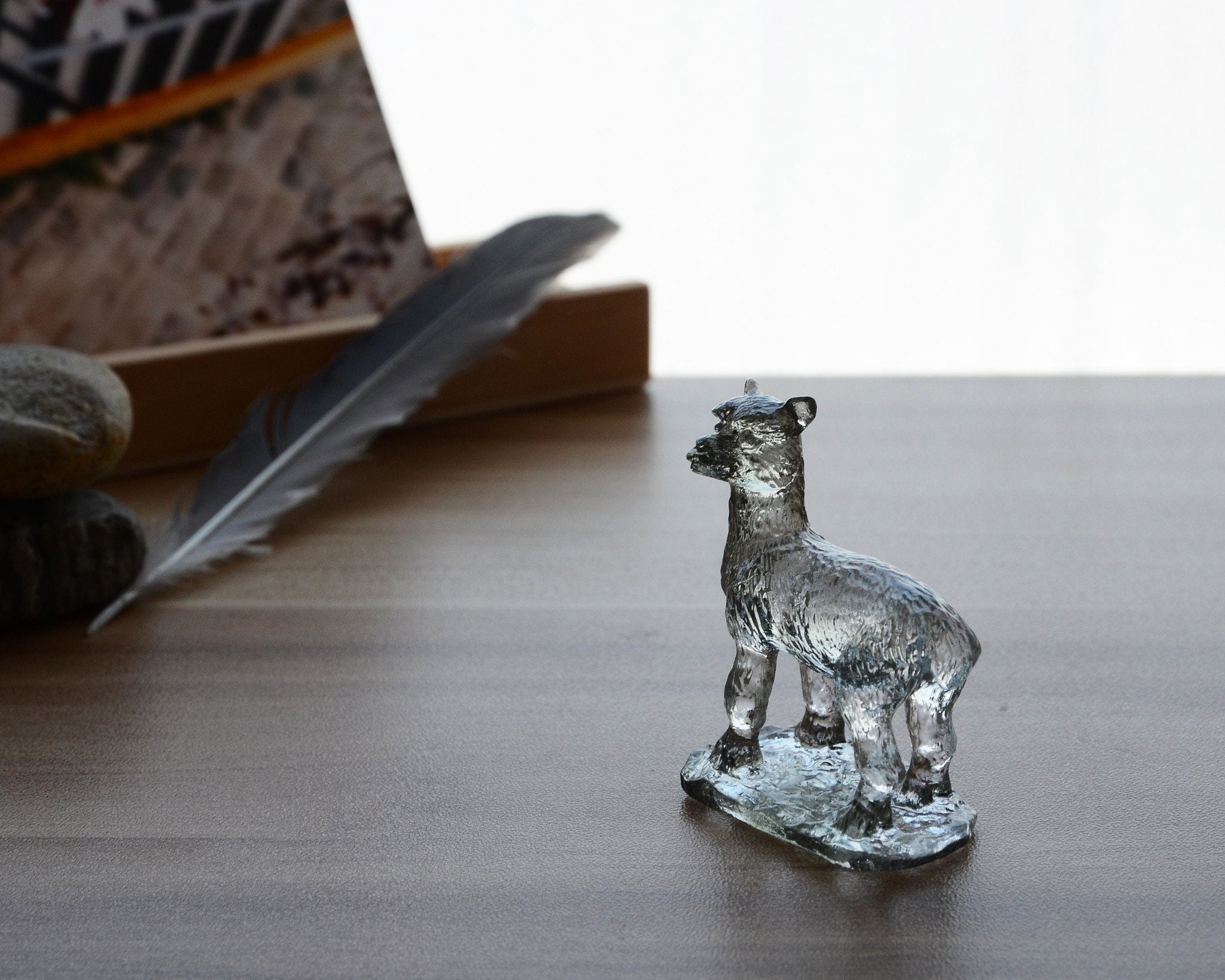 A beautifully crafted Liuli Crystal Alpaca Figurine showcasing intricate details and vibrant colors, perfect for home decor.