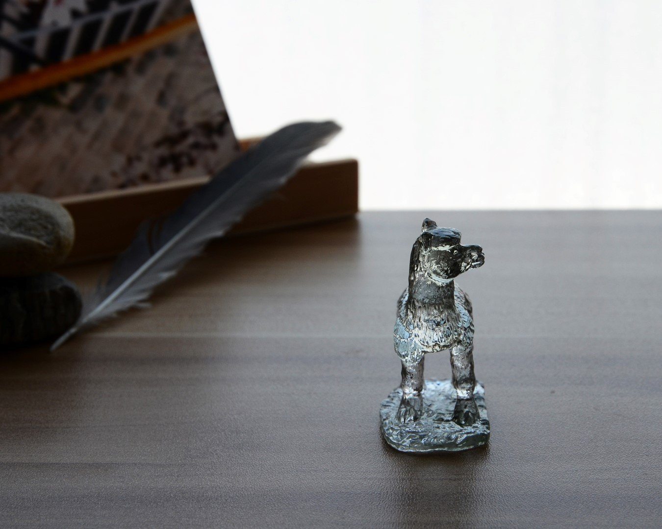A beautifully crafted Liuli Crystal Alpaca Figurine showcasing intricate details and vibrant colors, perfect for home decor.