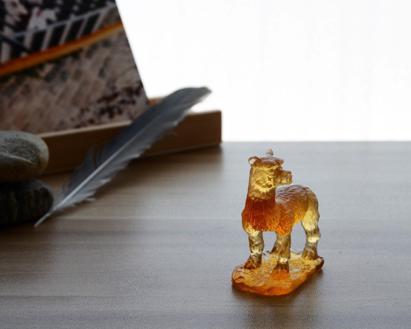 A beautifully crafted Liuli Crystal Alpaca Figurine showcasing intricate details and vibrant colors, perfect for home decor.