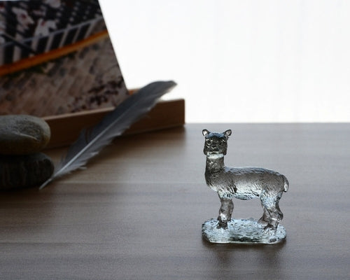A beautifully crafted Liuli Crystal Alpaca Figurine showcasing intricate details and vibrant colors, perfect for home decor.