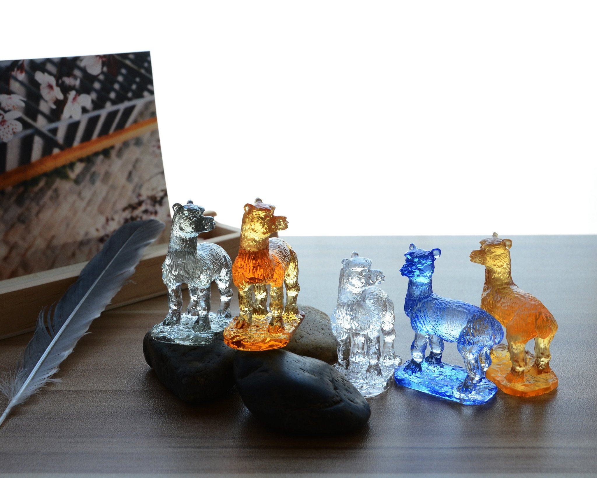 A beautifully crafted Liuli Crystal Alpaca Figurine showcasing intricate details and vibrant colors, perfect for home decor.