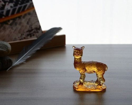 A beautifully crafted Liuli Crystal Alpaca Figurine showcasing intricate details and vibrant colors, perfect for home decor.