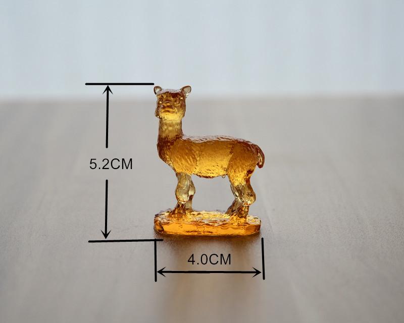 A beautifully crafted Liuli Crystal Alpaca Figurine showcasing intricate details and vibrant colors, perfect for home decor.