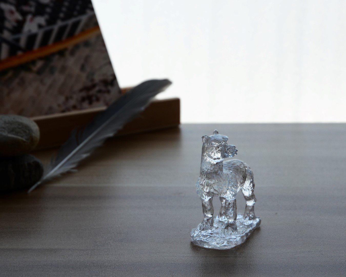 A beautifully crafted Liuli Crystal Alpaca Figurine showcasing intricate details and vibrant colors, perfect for home decor.