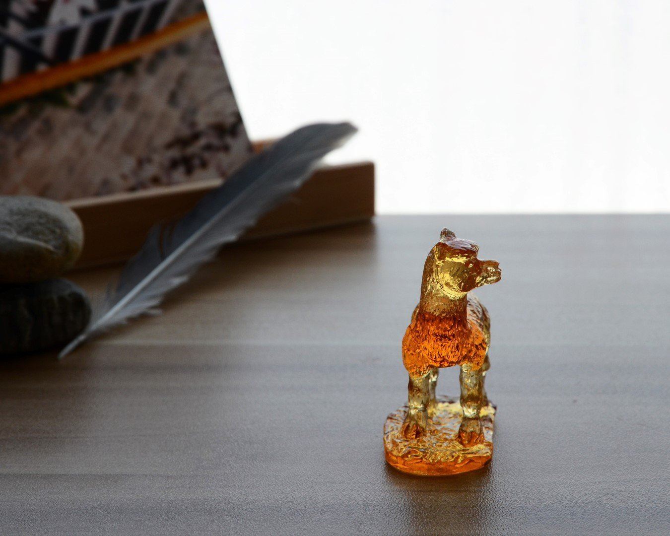 A beautifully crafted Liuli Crystal Alpaca Figurine showcasing intricate details and vibrant colors, perfect for home decor.