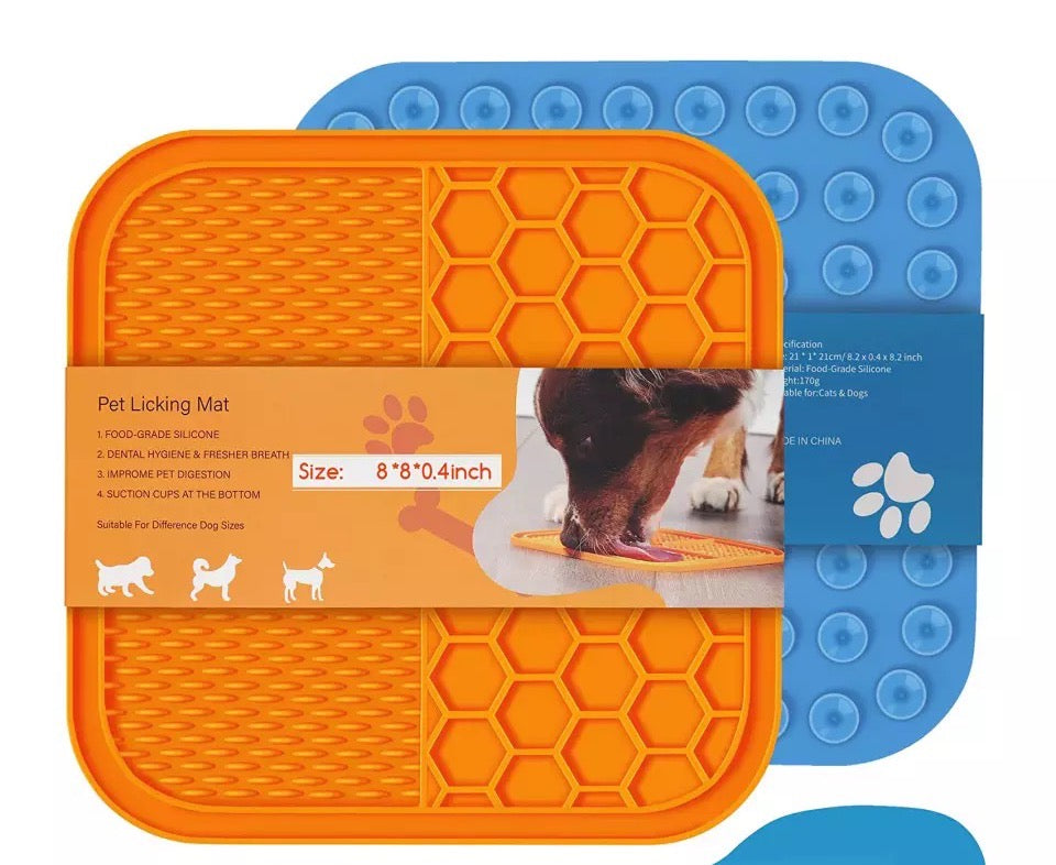 A colorful dog lick mat with suction cups, designed for slow feeding and calming pets during grooming.