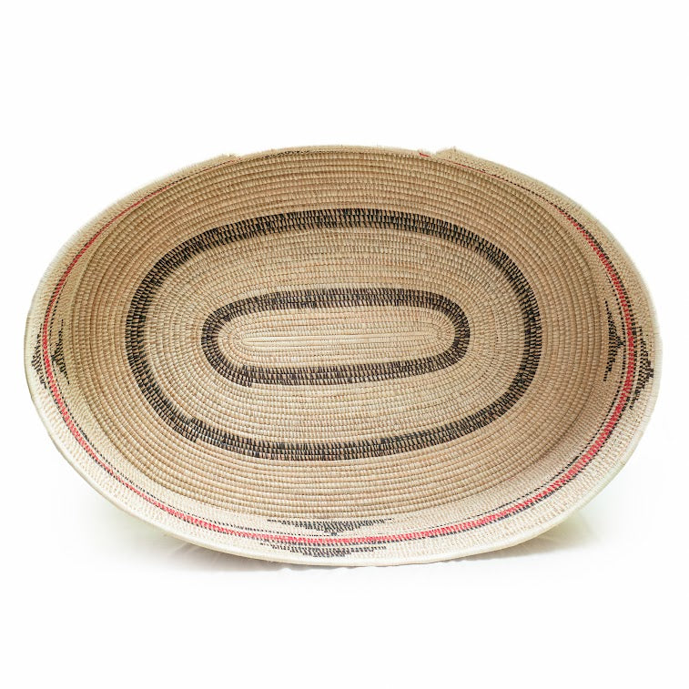 Mawenzi Handwoven Dog Bed showcasing vibrant colors and intricate patterns, handmade by skilled artisans using natural materials.