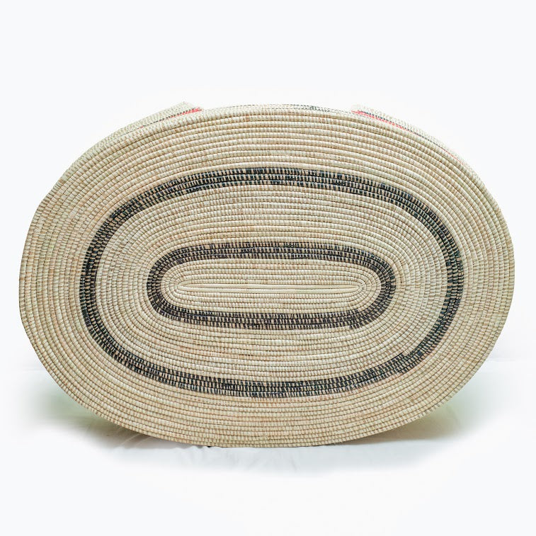 Mawenzi Handwoven Dog Bed showcasing vibrant colors and intricate patterns, handmade by skilled artisans using natural materials.