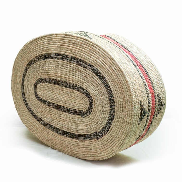 Mawenzi Handwoven Dog Bed showcasing vibrant colors and intricate patterns, handmade by skilled artisans using natural materials.