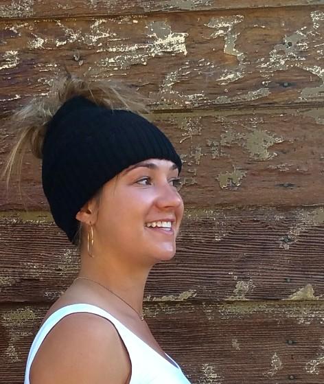 A cozy Messy Bun Alpaca Hat showcasing a stylish design with a ponytail hole, made from a soft alpaca blend, perfect for cool weather.