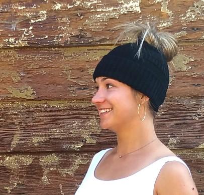 A cozy Messy Bun Alpaca Hat showcasing a stylish design with a ponytail hole, made from a soft alpaca blend, perfect for cool weather.