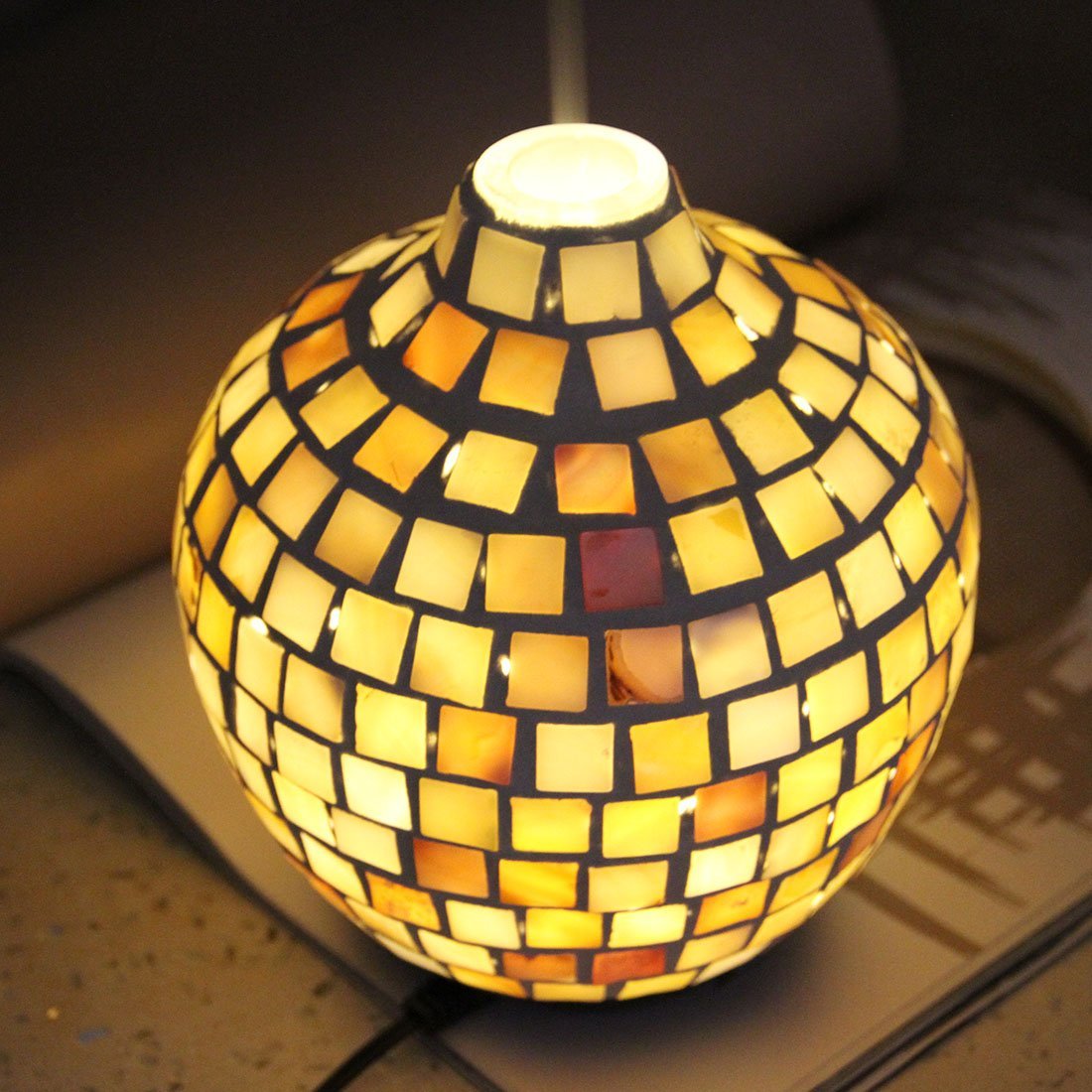 Mosaic Design Aroma Diffuser showcasing its unique hand-made glass design and warm yellow LED light.