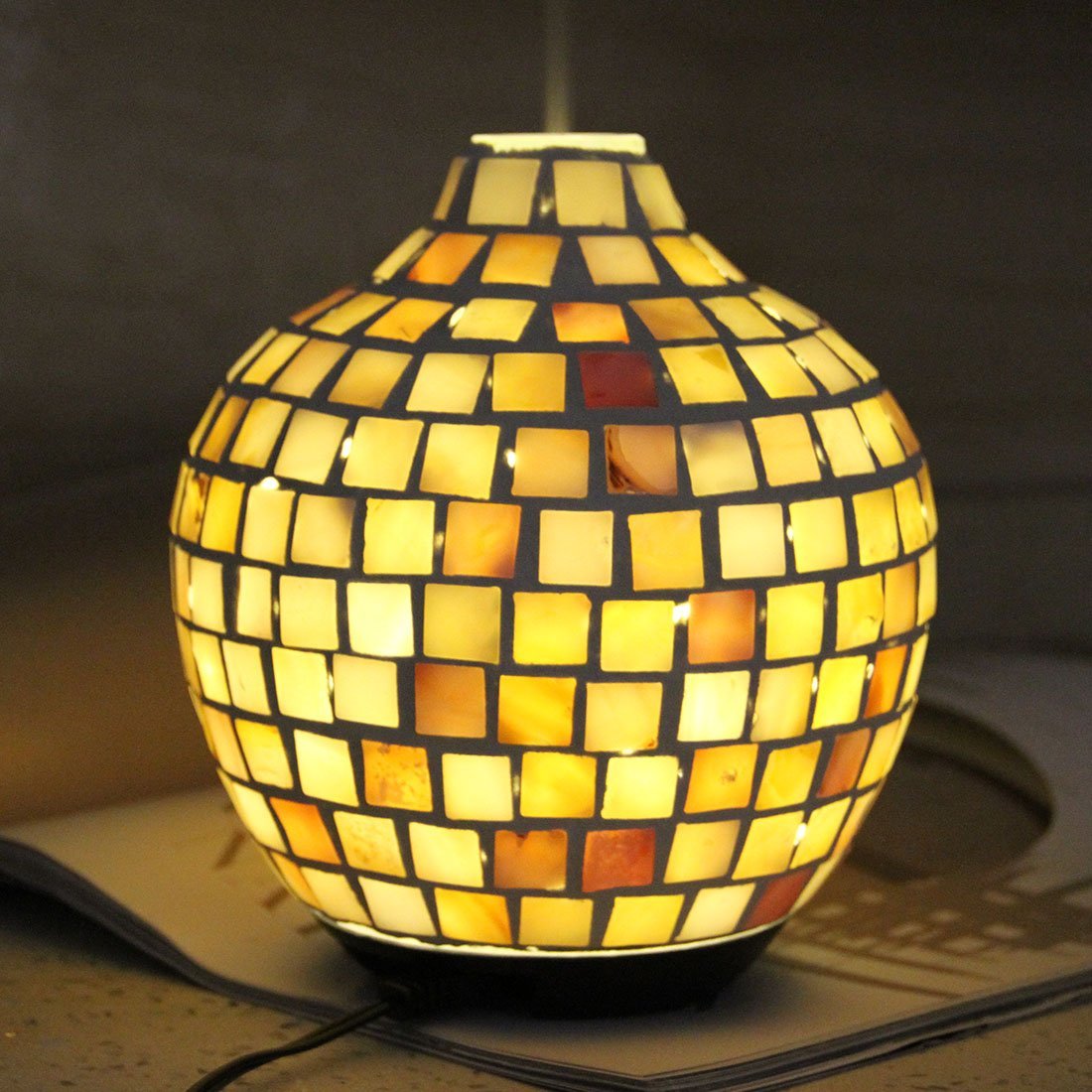 Mosaic Design Aroma Diffuser showcasing its unique hand-made glass design and warm yellow LED light.