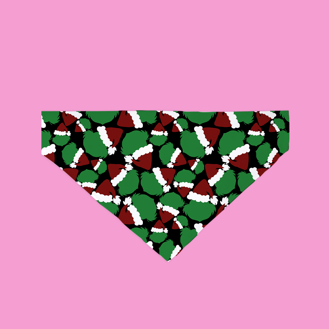 A festive Mr. Grouch Bandana featuring a green background with cute Santa patterns, designed for dogs and cats.