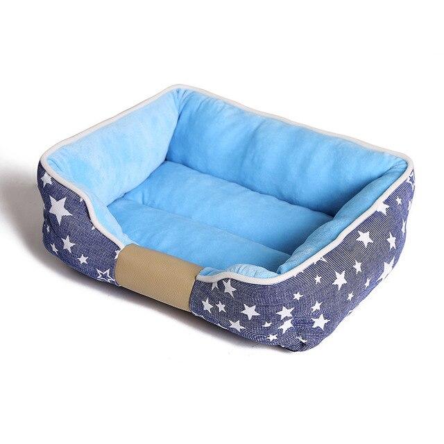 Non-slip pet dog bed in blue and pink, designed for comfort and warmth, suitable for dogs and cats.