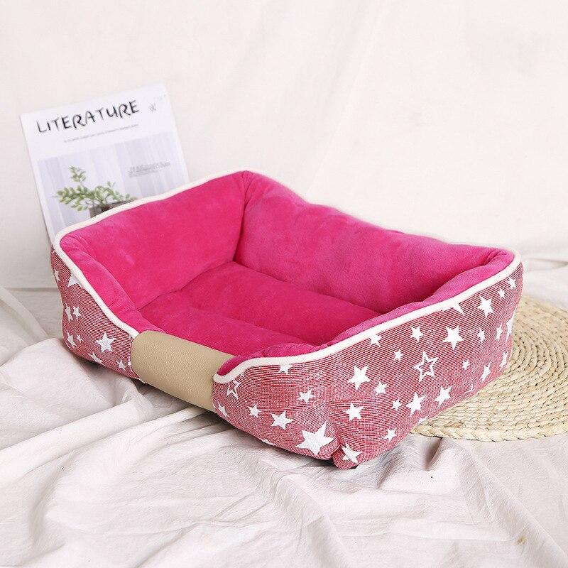 Non-slip pet dog bed in blue and pink, designed for comfort and warmth, suitable for dogs and cats.