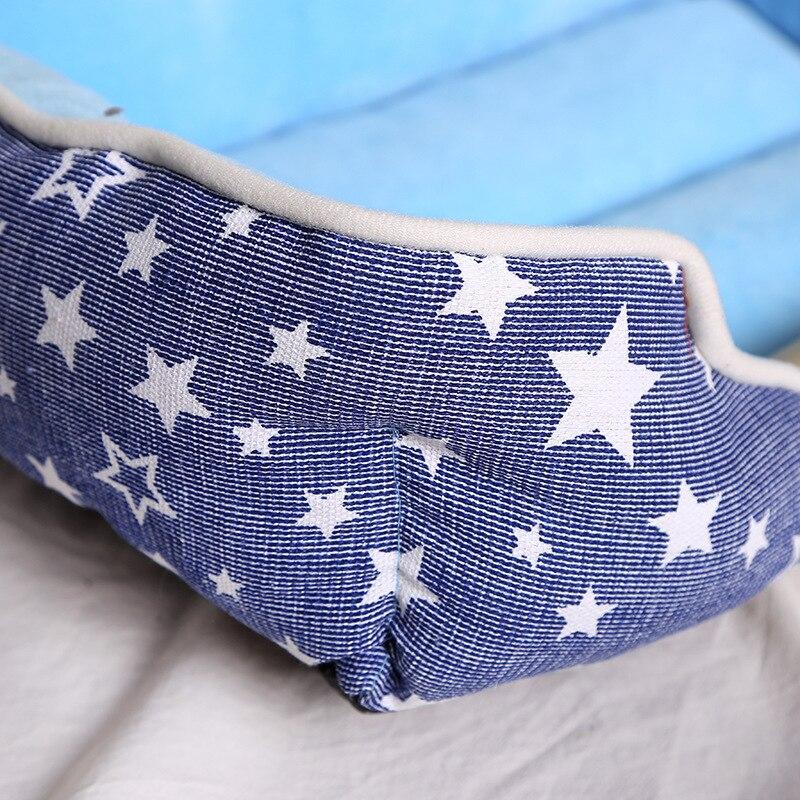Non-slip pet dog bed in blue and pink, designed for comfort and warmth, suitable for dogs and cats.